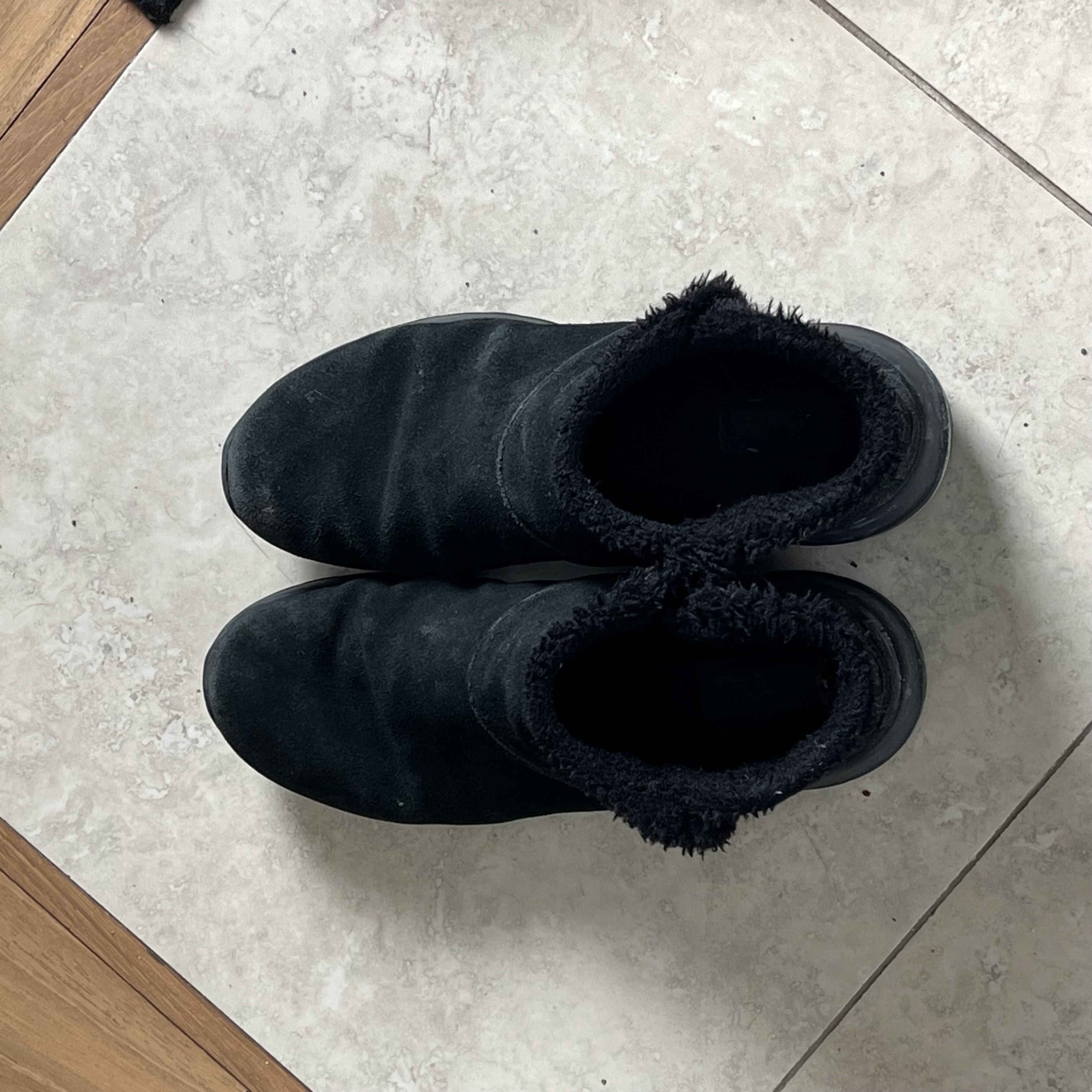 The sound of boots being dropped on the floor