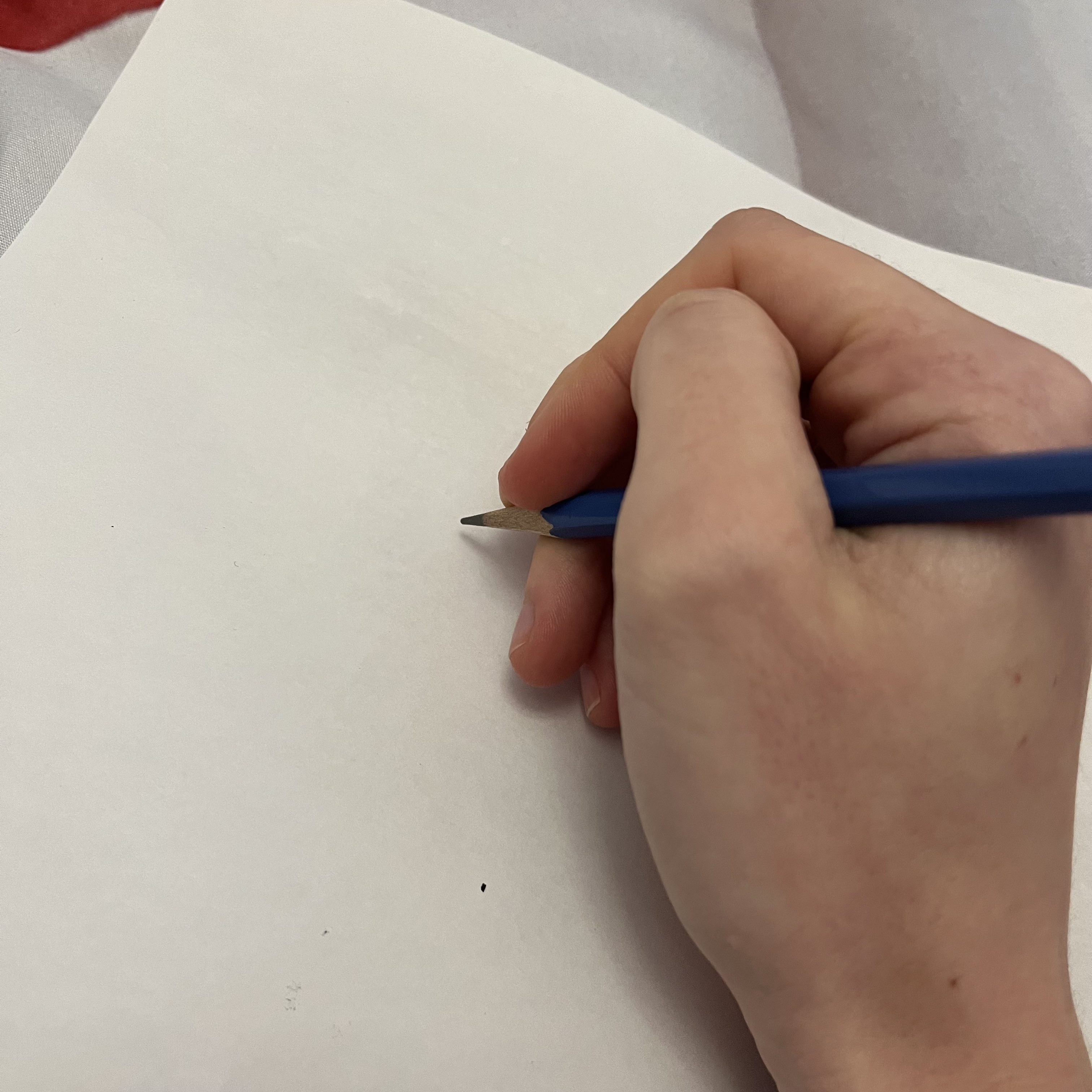 The sound of writing on a piece of paper with a pencil